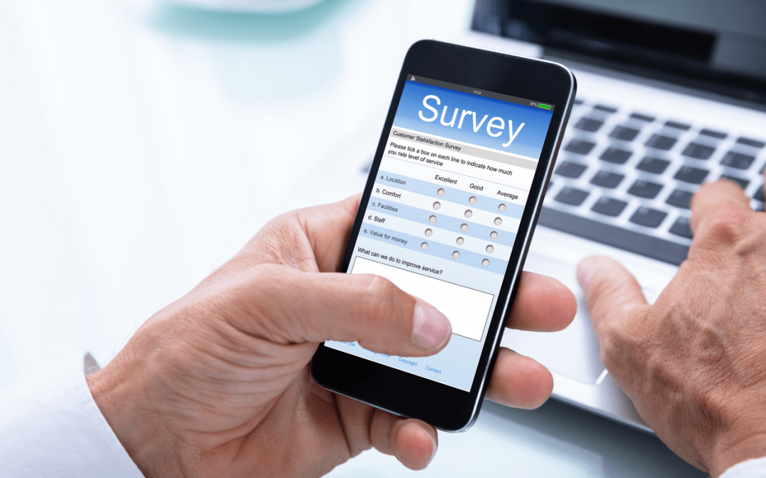 Businessman Filling Online Survey Form On Smartphone