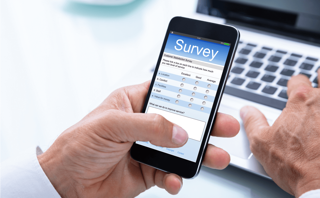 Businessman Filling Online Survey Form On Smartphone