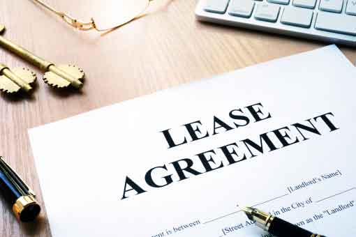 paper on desk that says lease agreement