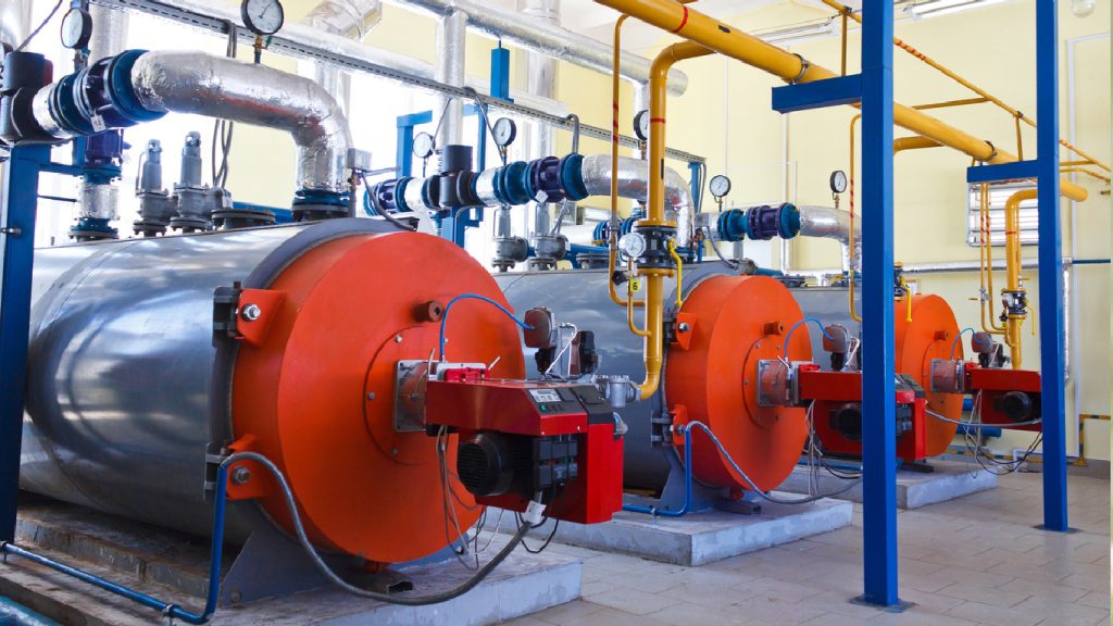 three boilers in a mechanical room