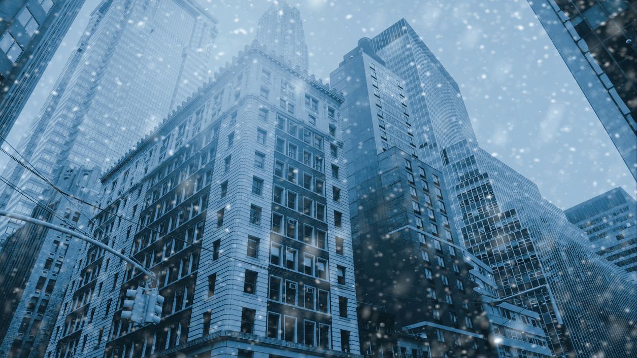 Famous Wall Street in New York City, Christmas time - snow winter blue background. NYC, USA